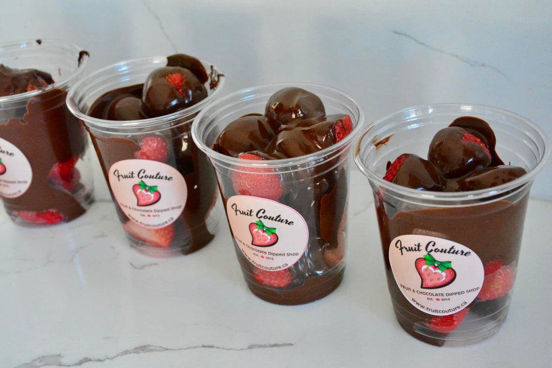 Strawberries in a cup with melted Belgian chocolate