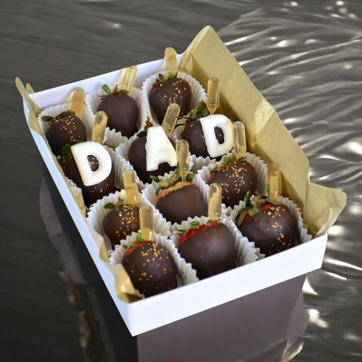 chocolate covered strawberries that spell out DAD and have little whisky pipettes inserted