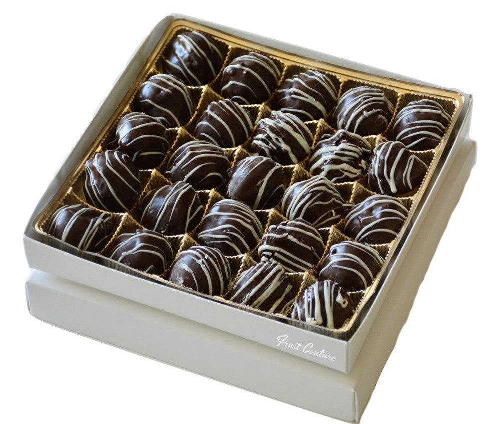 Box of 25 bite size chocolate covered apple truffles swizzled with white chocolate