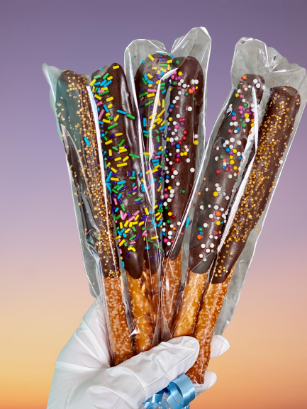 2 Pack of chocolate-covered pretzels with colourful sprinkles – gourmet treats available for delivery in Ottawa.