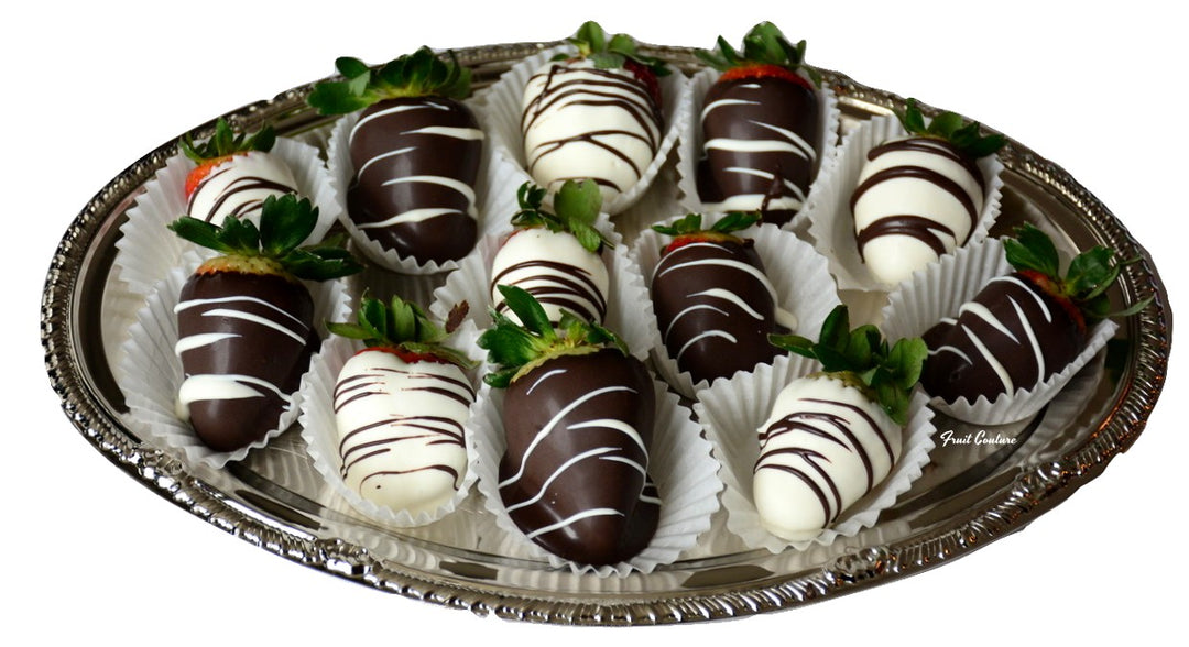 A dozen dark and white swizzled chocolate covered strawberries