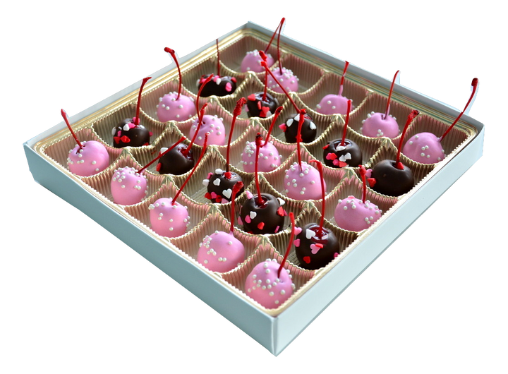 Box of 25 Valentine's Day theme maraschino cherries. Half dipped in pink chocolate with mini candy pearls and the other half dark chocolate dipped with heart sprinkles.